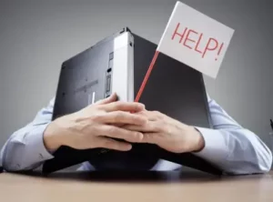 family tree mistakes has person holding laptop over head with a Help sign